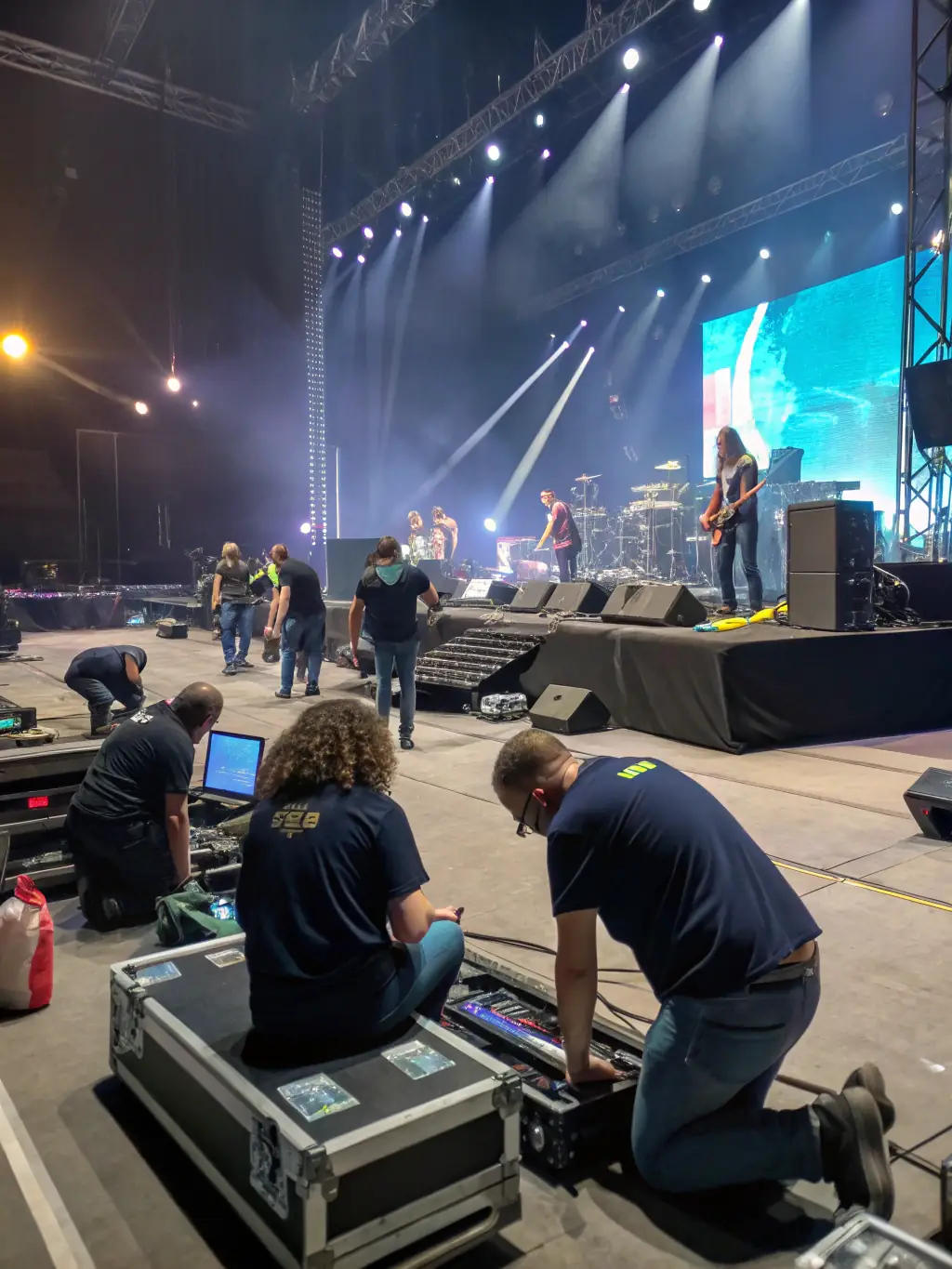 An image of volunteers setting up for a LA CHANSON A BOIRE event, highlighting the organization's reliance on community support.